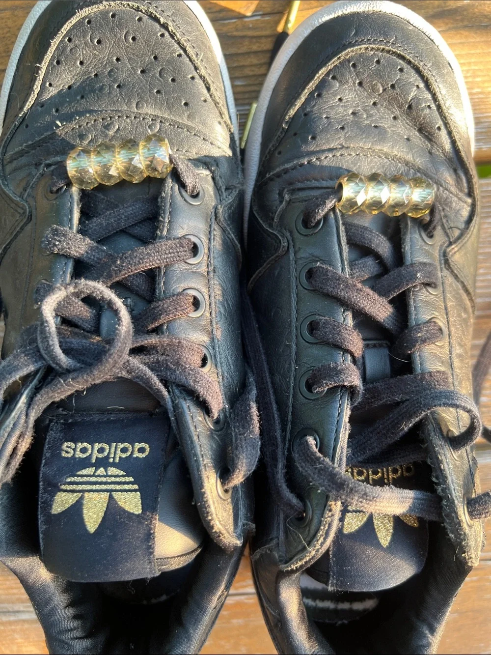 adidas Forum Black Leather Low-Top Sneakers with Gold Accents